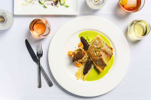 Golden Bass, White Asparagus, Morels, Cumin Pearl Barley, Parsley Sauce. Photo by Winter Caplanson, New England And Farm